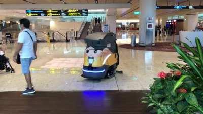 Robot floor cleaner at Changi Airport, working with a smile!