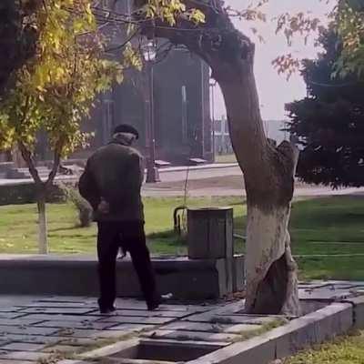 Armenian papik patiently waits his turn to drink from a fountain