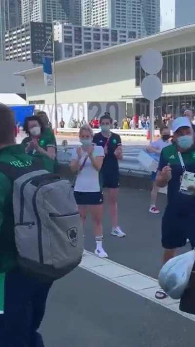 Paul O'Donovan and Fintan McCarthy returning to the Olympic village after their gold medal win