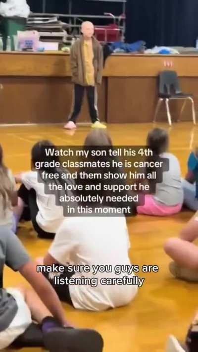 Boy tells his classmates that he's cancer free.