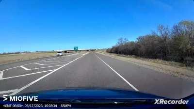 Idiot stopped in the oncoming lane waiting to illegally U-turn.