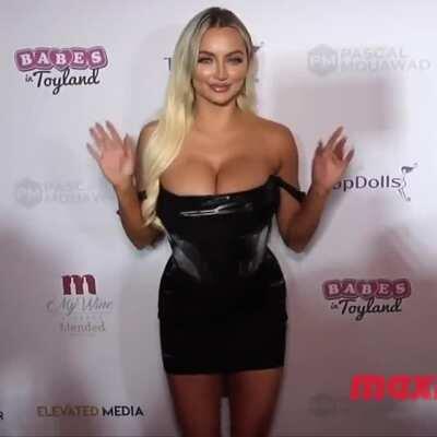 Lindsey Pelas bursting out of a black dress