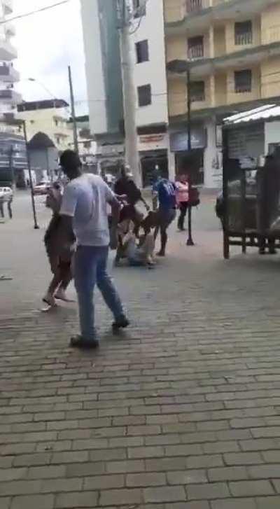 Man is seen hitting a woman In public but he doesn't realize that brazilians like to take the law Into their own hands.