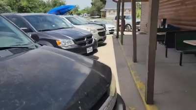 Racist guy harasses random people outside a gas station