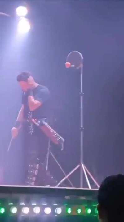 Guy gets his ear pierced with an arrow.