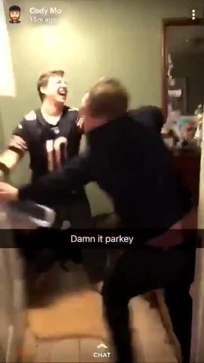 Kid has a real beef with this door after his team lost a football game
