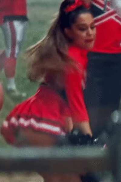Twerking in a cheerleader outfit