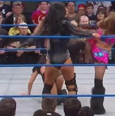 Victoria gets kicked in the belly, then the rope gives her an embarrassing wedgie