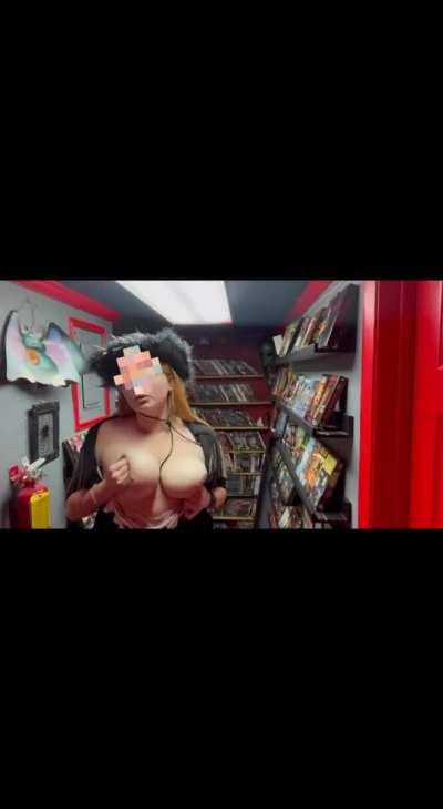 Perverse cowgirl gone wild in a video store [gif]