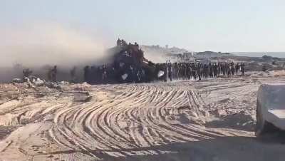 Starving Palestinians raid an aid truck