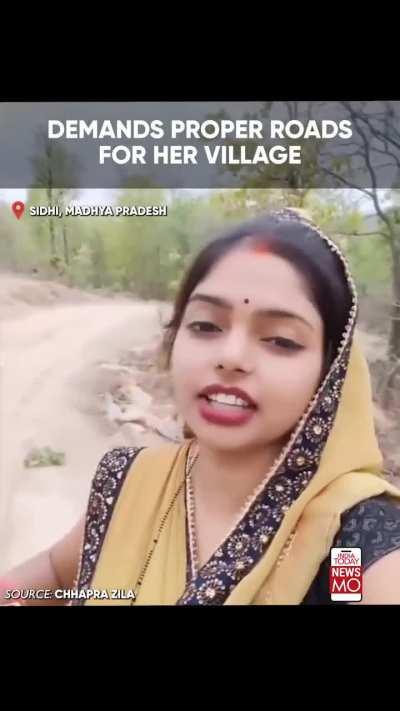 A woman urges PM Modi to build a road in her area, highlighting its poor condition despite complaints to local officials