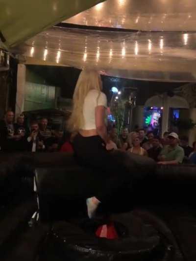Liv Morgan riding a bull