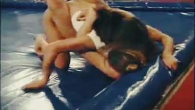 These two attractive, fit, young women, fight in front of a crowd of perverts. 