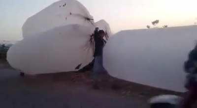 People in Pakistan are stocking gas in plastic bags instead of cylinders for cooking as prices are skyrocketing. Gas is sold by filling bags inside the shops connected to the gas pipeline network.