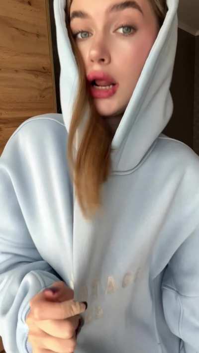 A cute hoodie reveals a petite snack underneath