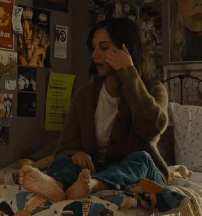 Pouting on her bed (from 