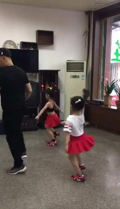 Like father like daughters, dancing like pros.
