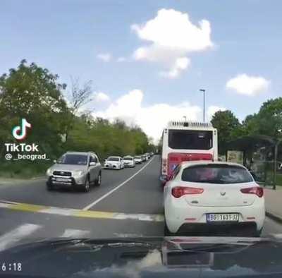 Idiot almost hits a woman on a crosswalk