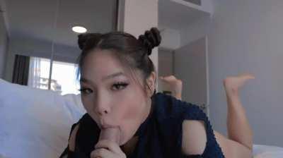 Cute asian girl sucking a cock