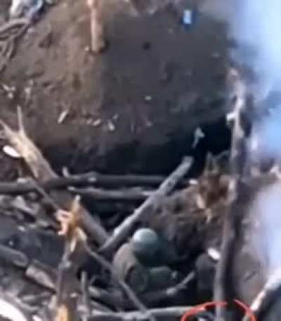 russian soldiers helps an unexploded drone