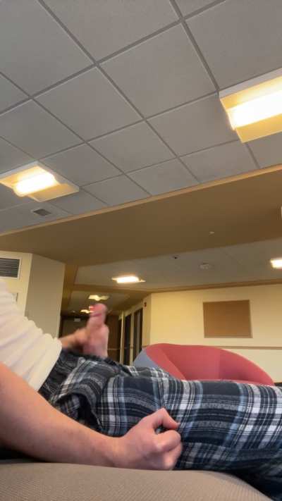 Jerking off and cumming in the communal area of the dorm