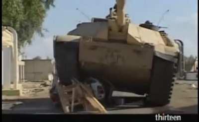 U.S tanks crushes Iraqi civilian car for stealing wood after Iraqi government collapse