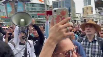 Scuffles break out between police and anti-vaccine passport protestors as they try to enter Eaton Centre