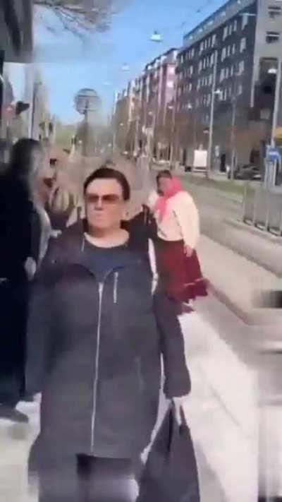 Woman shits and hands and throws that another woman