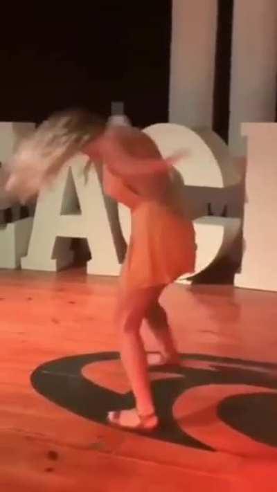 Her head almost hit the floor.