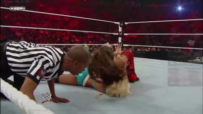 Nikki Bella working on Kelly Kelly's shoulder