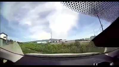 Japan. Car hits a fence then into a river. No info but i think author is injured