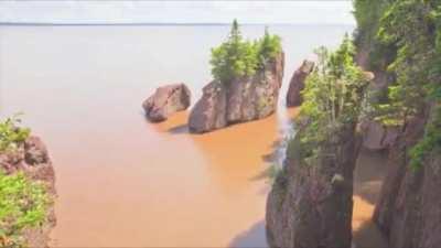 The Bay of Fundy has a massive tide of up to 52 ft (16 m): nearly 100 billion tons of water