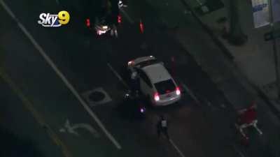 Mob chases down, rams, boxes in, and attacks a car , trying to pull the driver out [Los Angeles]