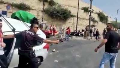[Israel] Police officer saves man from getting stoned by a mob