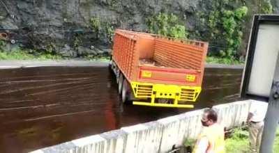WCGW driving over a oil spill on the road?