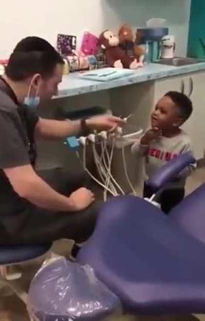 Magic doctor entertains a child