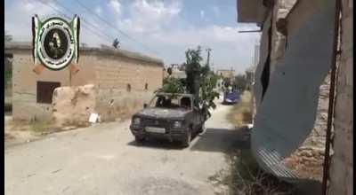 Is it a tree? No, it is a Mitsubishi pickup with a HMG on the back.