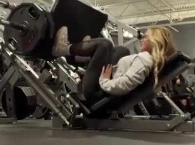 Girl almost gets stuck under the weight on leg machine 
