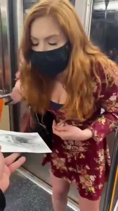 Artist draws a portrait of a woman in nyc subway