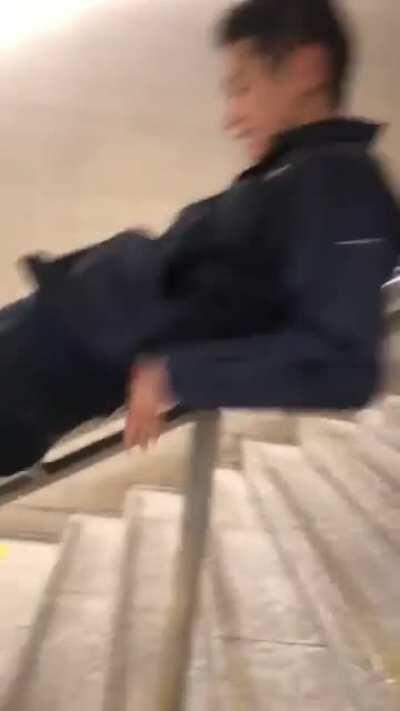 Sliding down public stairways