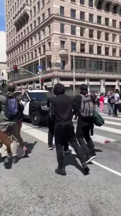 Police officer bashes truck into protesters then flees like a coward