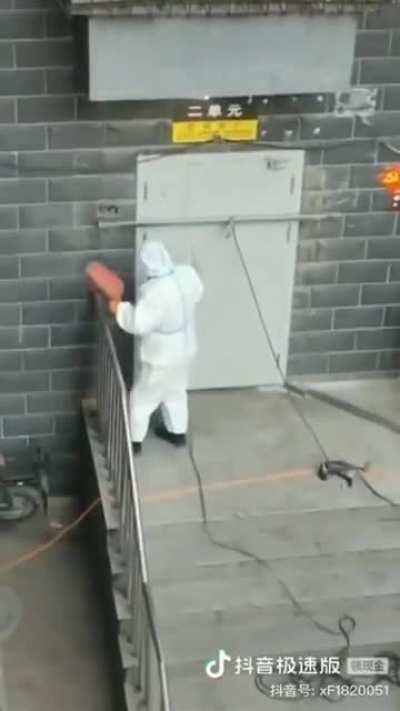 welding apartment doors shut in China to enforce the quarantine