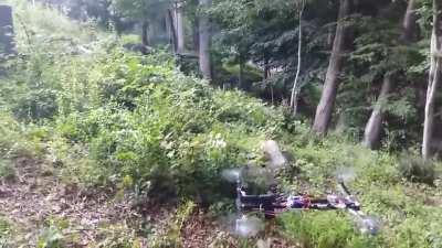 A flying drone equipped with a handgun firing rounds