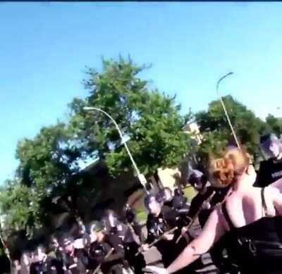 Louisville police push down a protestor who was lawfully on the sidewalk, then shoot at people who come to help her up