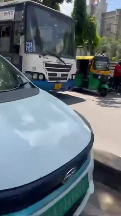 Car driver confronts wrong side two wheeler.