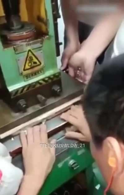 Fingers + hydraulic press.