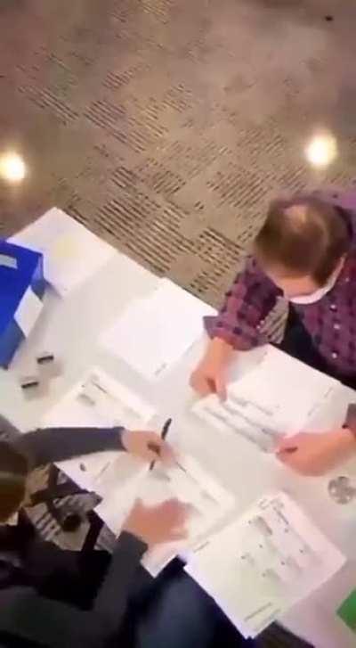 VIDEO poll worker filling out ballots with security guard totally aware!