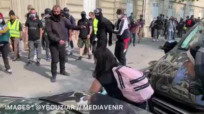 Paris: Elderly man tries to stop black bloc rioter from smashing a car at the Yellow Vest protest. The rioter shoves him to the ground.