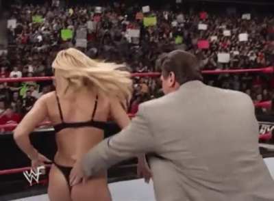 Vince gives Trish a thong wedgie after forcing her to strip down