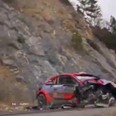 Rally car drivers looking rather relaxed during huge crash